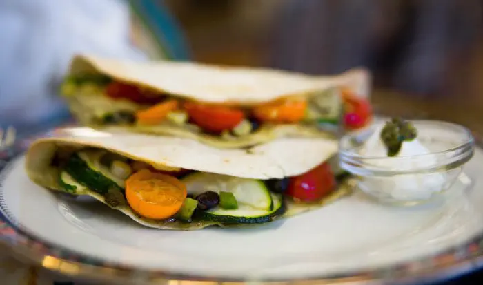 Two veggie quesadilla on white plate close up