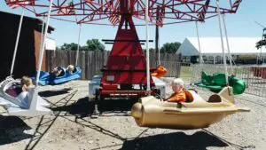Carnival Rides at Millstadt Farm. Kiddie ride airplane.