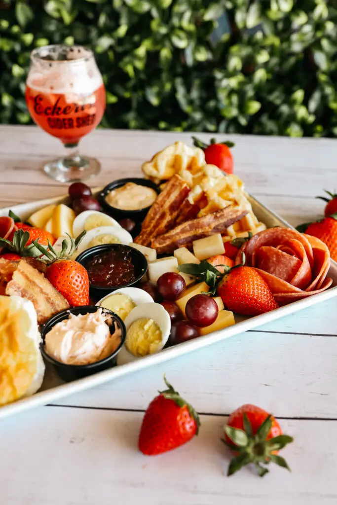 Enjoy brunch in the Cider Shed every Sat & Sun. Food assortment on a platter on table.