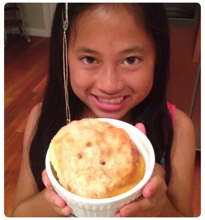 Girl Holding Mini Peach Cobbler