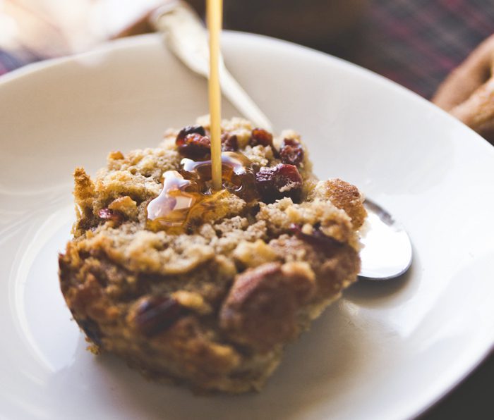 Drizzling Honey onApple Cider Donut Bread Pudding