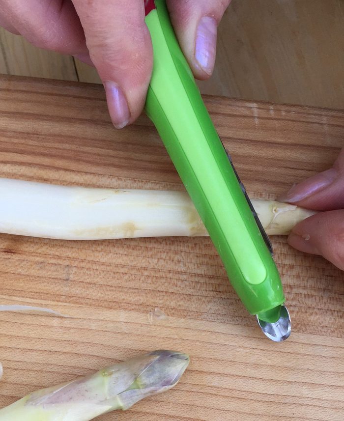 peeling asparagus