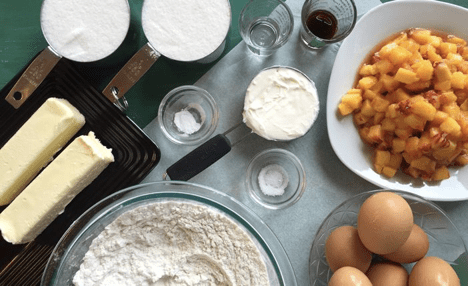 Various baking ingredients are neatly arranged on a table, ready for use.